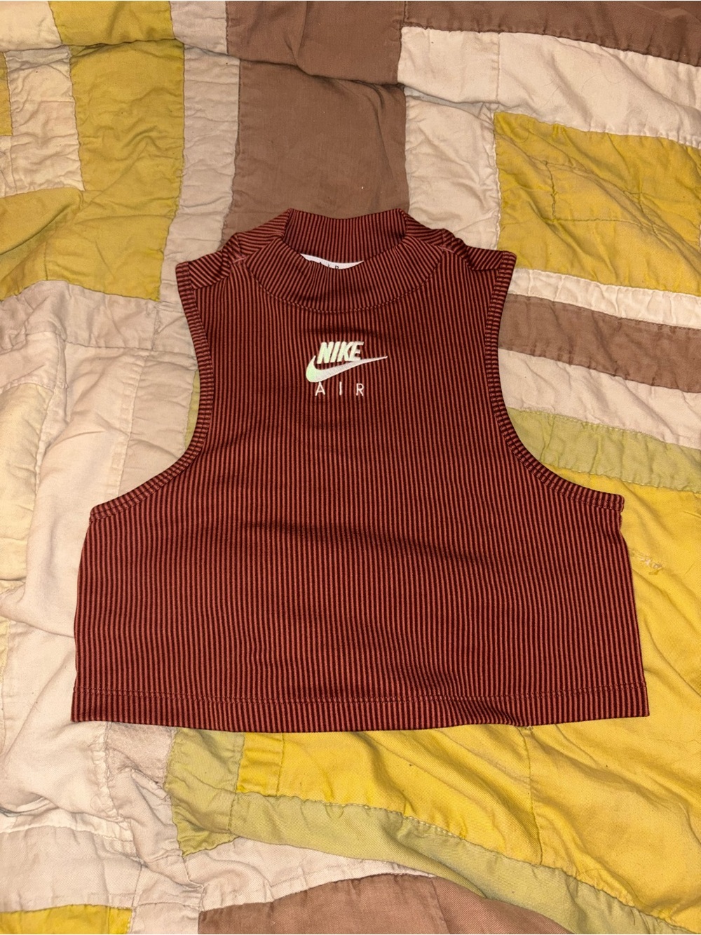 Nike Ribbed Mock Neck Crop Tank in Rust Red
